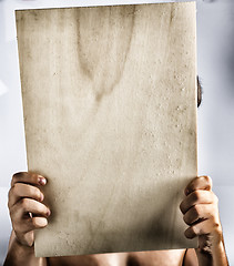 Image showing Plywood sign held up by young hands