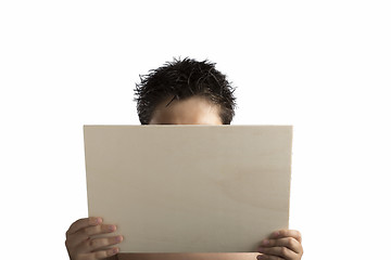 Image showing Plywood sign held up by young hands