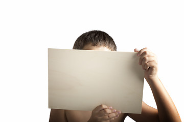 Image showing Plywood sign held up by young hands