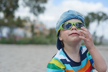 Image showing Little boy in denim hat and sunglasses