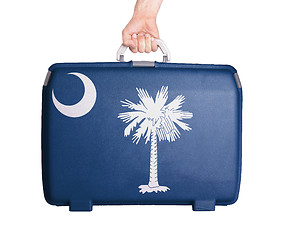 Image showing Used plastic suitcase with stains and scratches