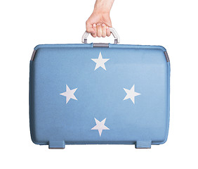 Image showing Used plastic suitcase with stains and scratches