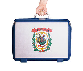 Image showing Used plastic suitcase with stains and scratches