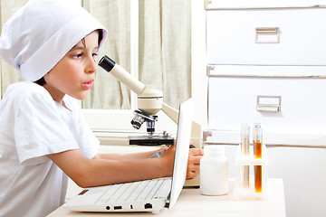 Image showing Little boy doing biochemistry