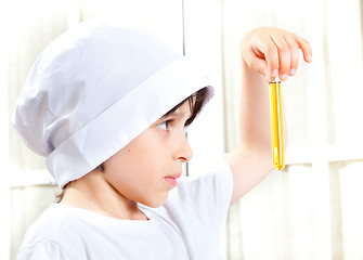 Image showing Little boy doing biochemistry