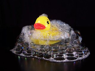 Image showing Yellow Rubber Duck In A Small Bubble Bath