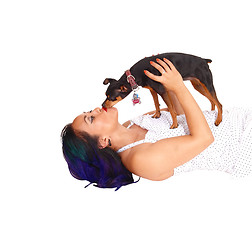 Image showing Woman kissing her dog.