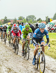 Image showing The Peloton on a Cobbled Road- Tour de France 2014