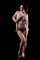 Image showing Pretty topless woman body covering by rope