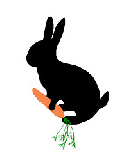 Image showing The black silhouette of a bunny with carrot on white