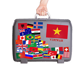 Image showing Used plastic suitcase with stickers