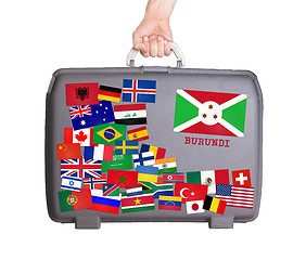 Image showing Used plastic suitcase with stickers