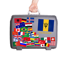 Image showing Used plastic suitcase with stickers