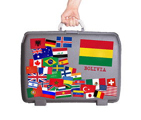 Image showing Used plastic suitcase with stickers