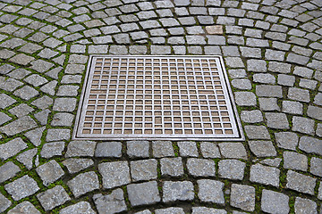 Image showing Paving stones with metal manhole