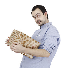Image showing Young man holding a present