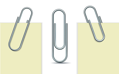 Image showing Metal paperclip and paper