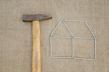 Image showing hammer and outbuilding form of nail linen texture  