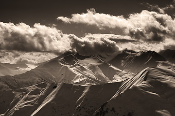 Image showing Sepia evening mountains and sunlight clouds