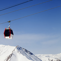 Image showing Gondola lift and snowy mountains