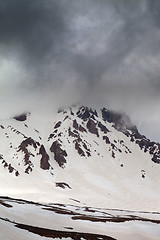 Image showing Top of mountains in storm clouds