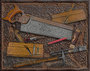 Image showing vintage woodworking tools over rusty plate