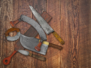 Image showing vintage kitchen knives  collage over old wood