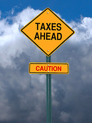 Image showing caution taxes ahead post sign