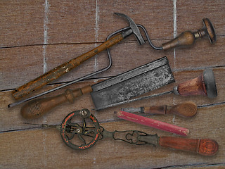 Image showing vintage woodworking tools over drift wood