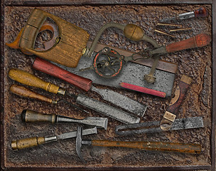 Image showing vintage woodworking tools over rusty plate