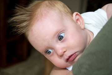 Image showing An almost four month old baby girl on daddy's arm