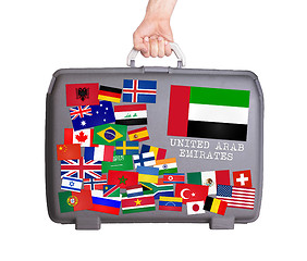 Image showing Used plastic suitcase with stickers