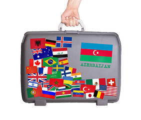 Image showing Used plastic suitcase with stickers