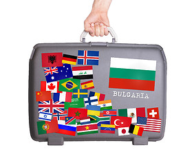 Image showing Used plastic suitcase with stickers