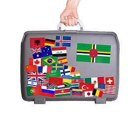 Image showing Used plastic suitcase with stickers