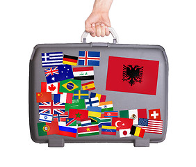 Image showing Used plastic suitcase with stickers