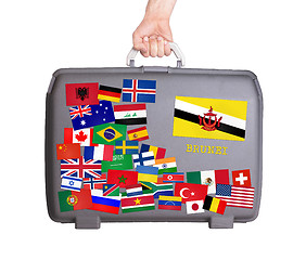 Image showing Used plastic suitcase with stickers