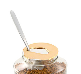 Image showing Teaspoon in a freshly opened jar of aromatic coffee 