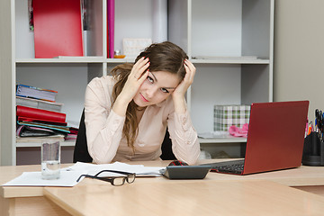 Image showing Office worker grabbed his hands behind head