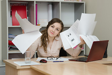 Image showing Office Specialist with a bunch of papers