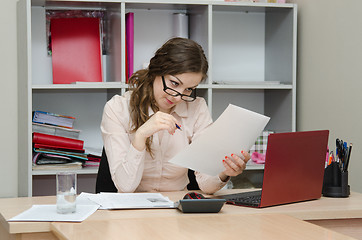 Image showing Accountant reading an important document