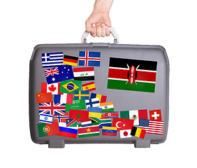 Image showing Used plastic suitcase with stickers