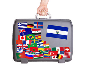 Image showing Used plastic suitcase with stickers