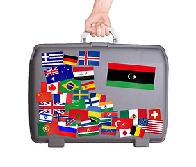 Image showing Used plastic suitcase with stickers