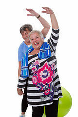 Image showing Two senior women doing gym exercises