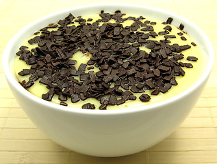 Image showing Custard with grated chocolate in a bowl of china ware
