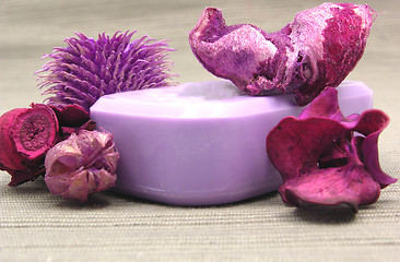 Image showing Lilac soap with decoration articles on a  gray  background