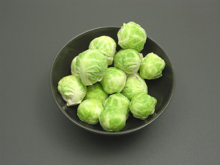 Image showing Bowl of chinaware with brussels sprouts on a dull matting