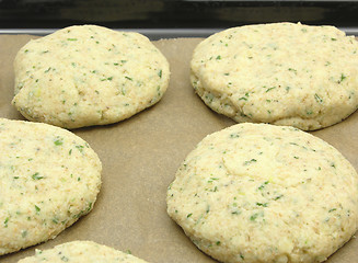 Image showing Potato herbs burger on a baking tray