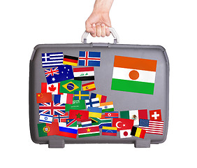 Image showing Used plastic suitcase with stickers